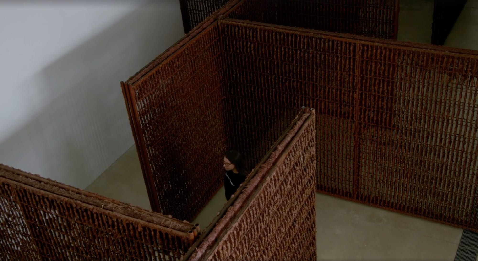 a person walks through soil walls